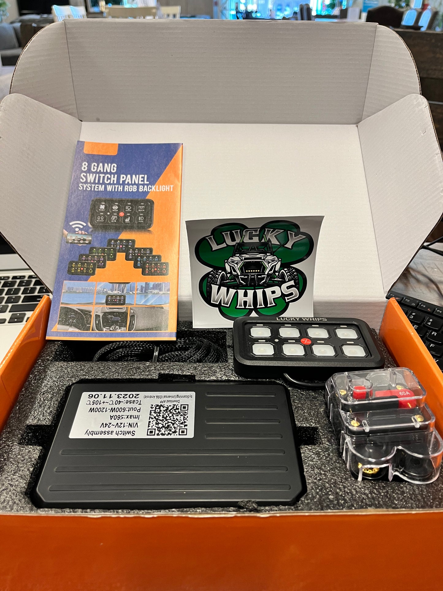 Lucky Whips 8 Gang Bluetooth switch panel with illuminated switches and a sleek, modern design.