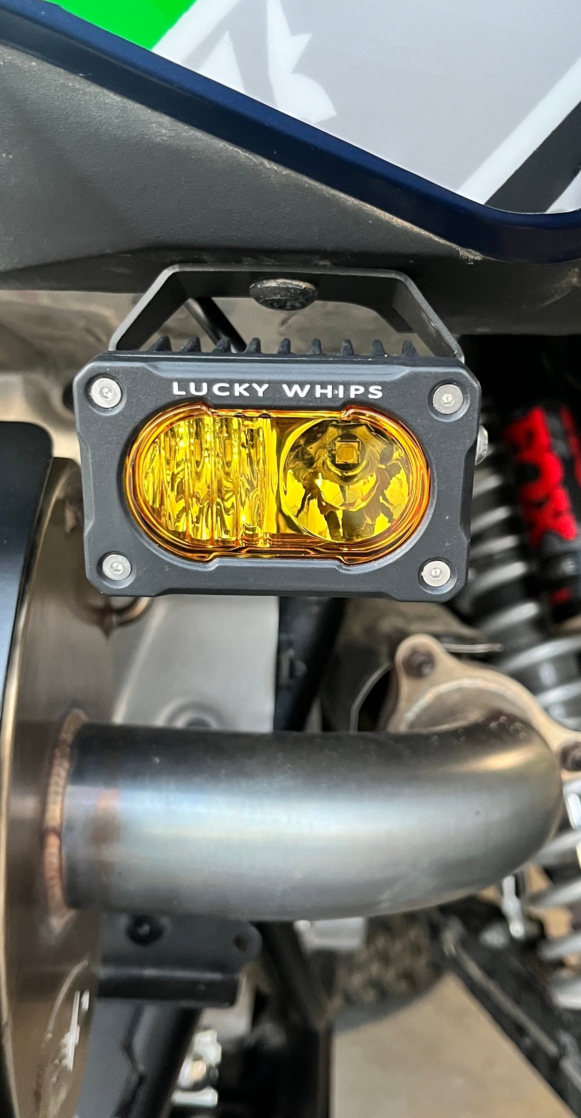 Amber LED Desert Series Mini Pod by Lucky Whips with sleek compact design and textured surface.