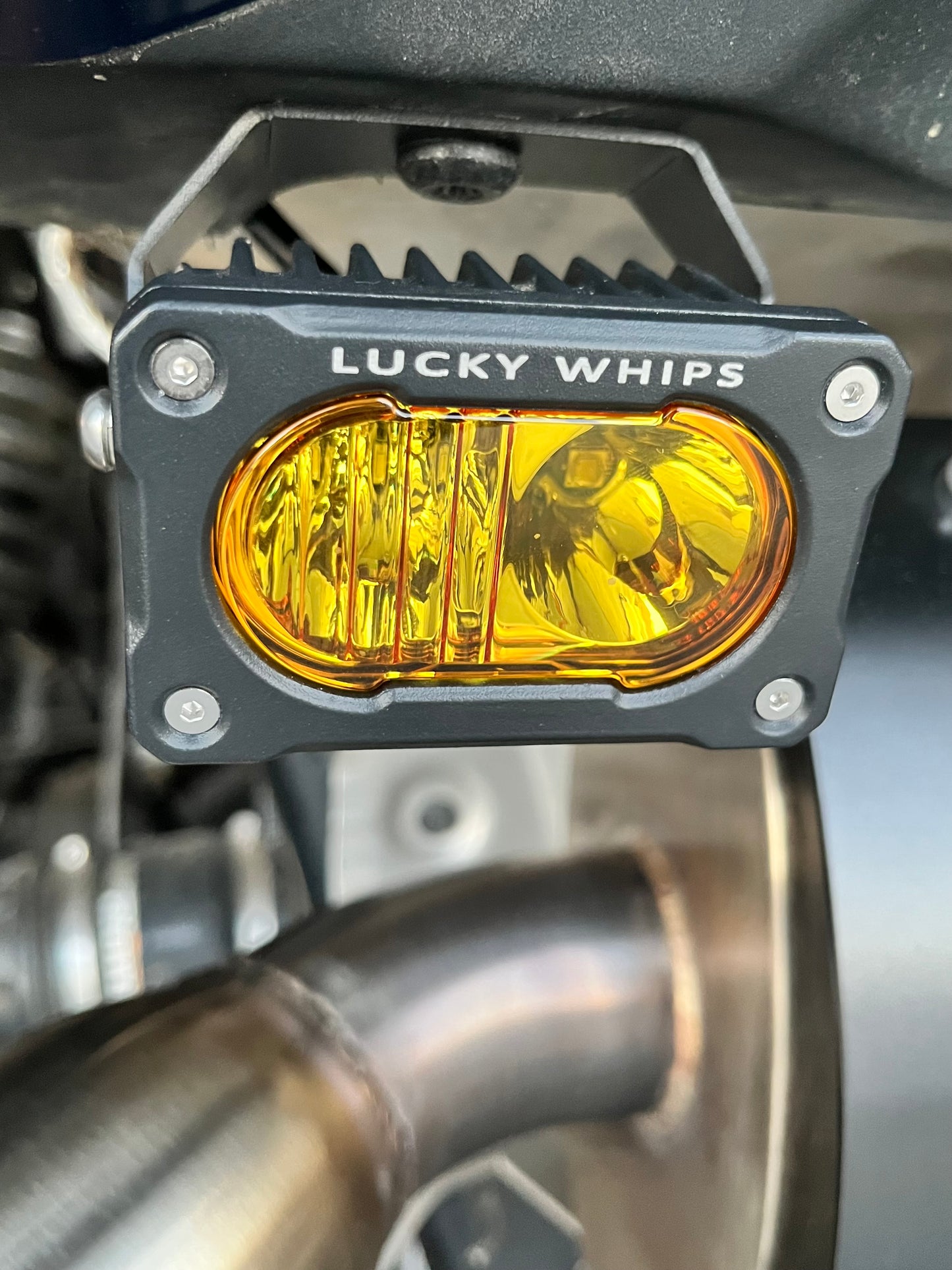 Amber LED Desert Series Mini Pod by Lucky Whips with sleek, compact design and glowing amber light.