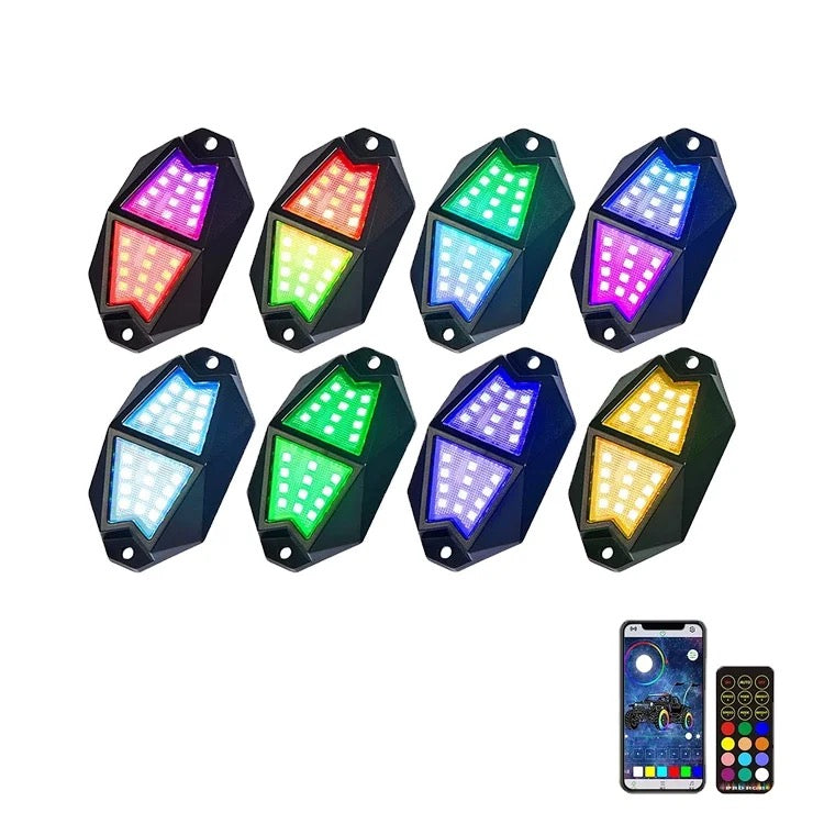 Colorful Lucky Whips Chasing Color Rock Lights illuminating a rocky surface in a dark setting.