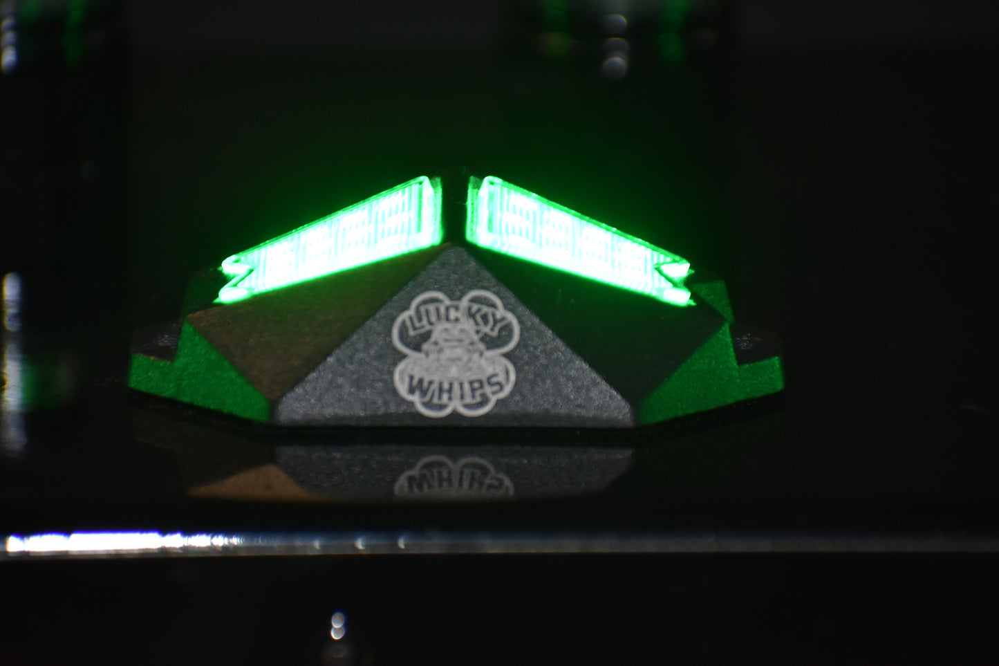 Chasing Color RGB Rock Lights by Lucky Whips illuminating outdoor landscape with vibrant colors at night.