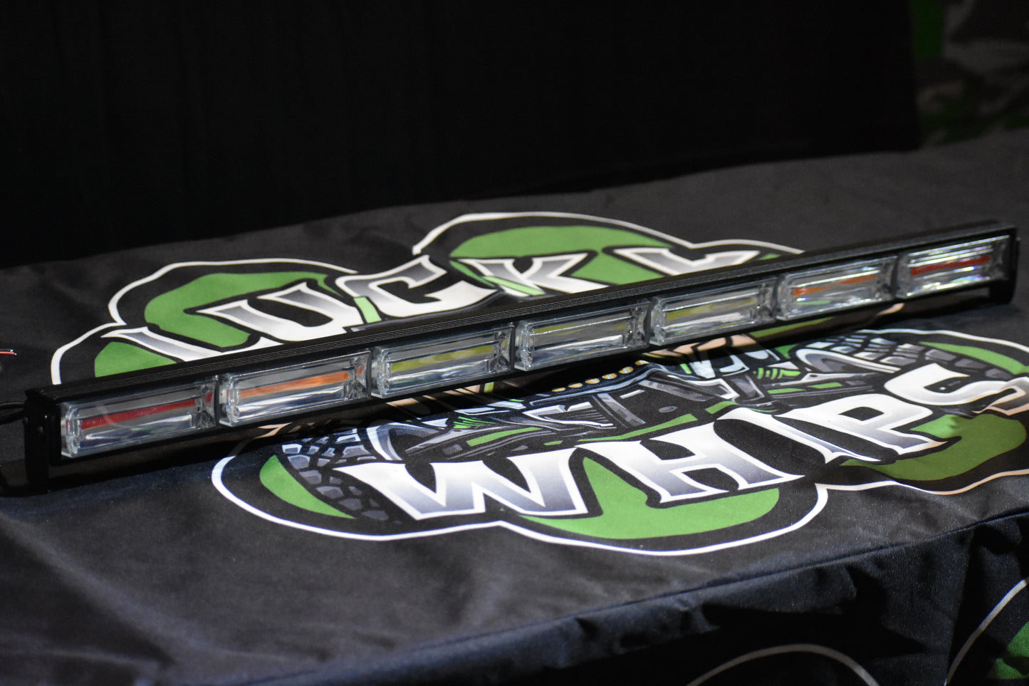 Lucky Whips Cob LED Chase Light with multiple color options illuminating in a dark setting.