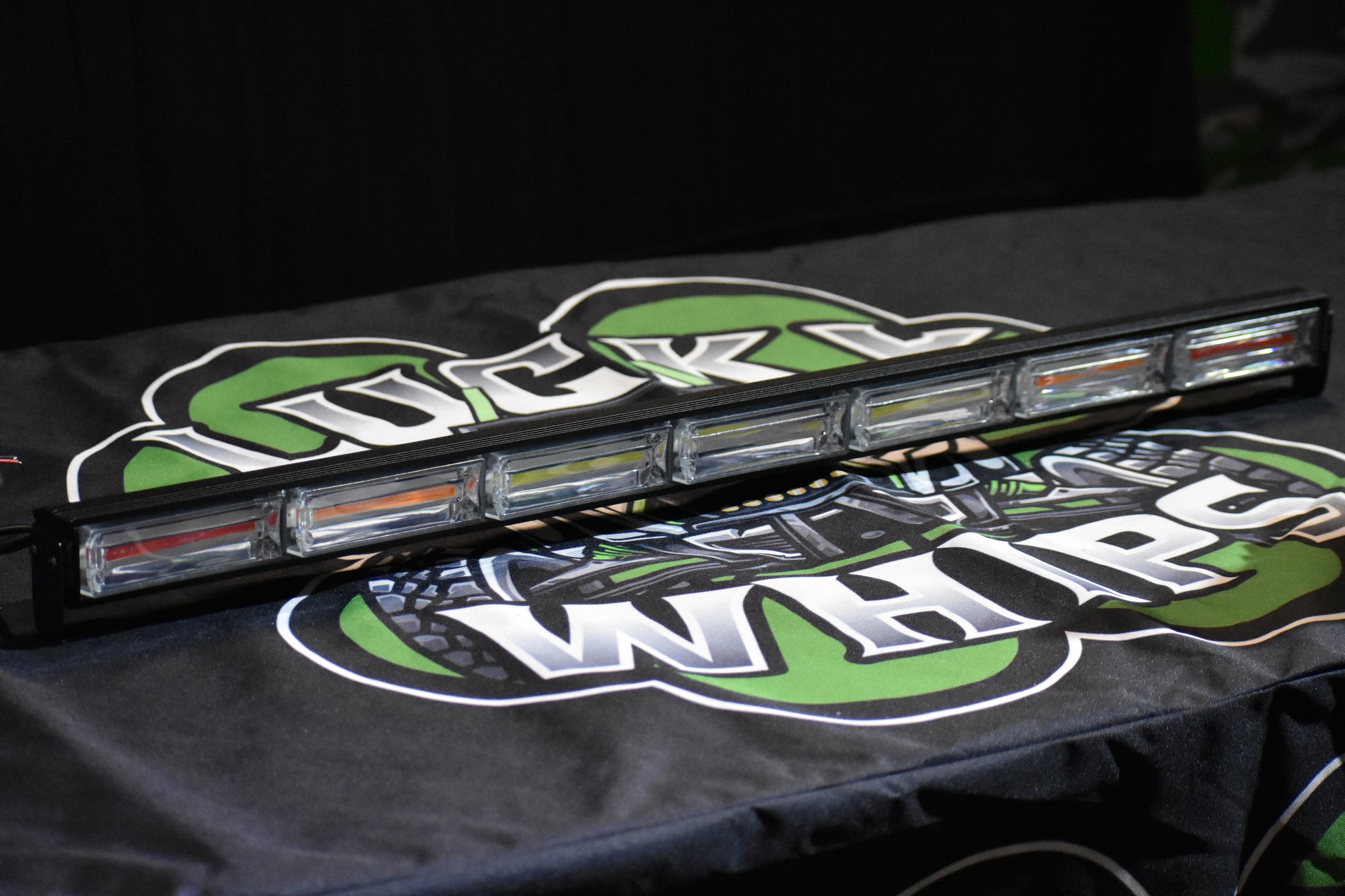 Lucky Whips Cob LED Chase Light with multiple color options illuminating in a dark setting.