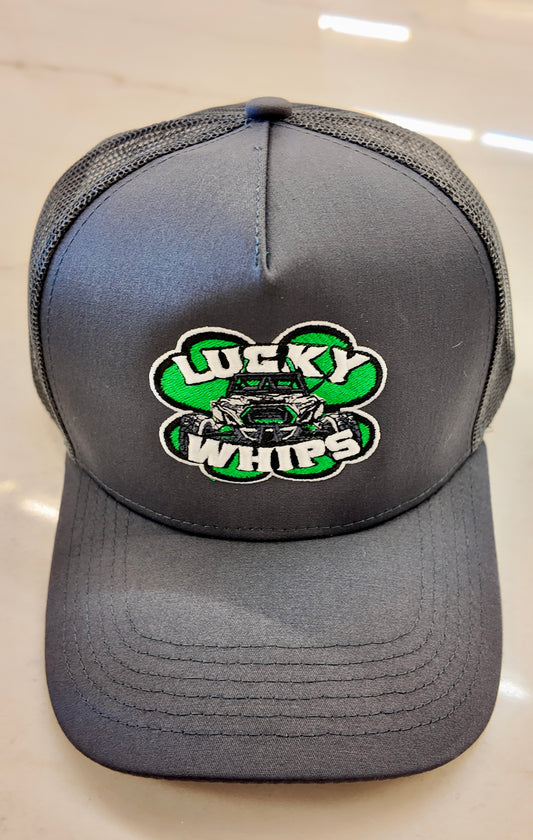 Charcoal trucker hat with a curved bill by Lucky Whips, featuring a breathable mesh back and adjustable snap closure.