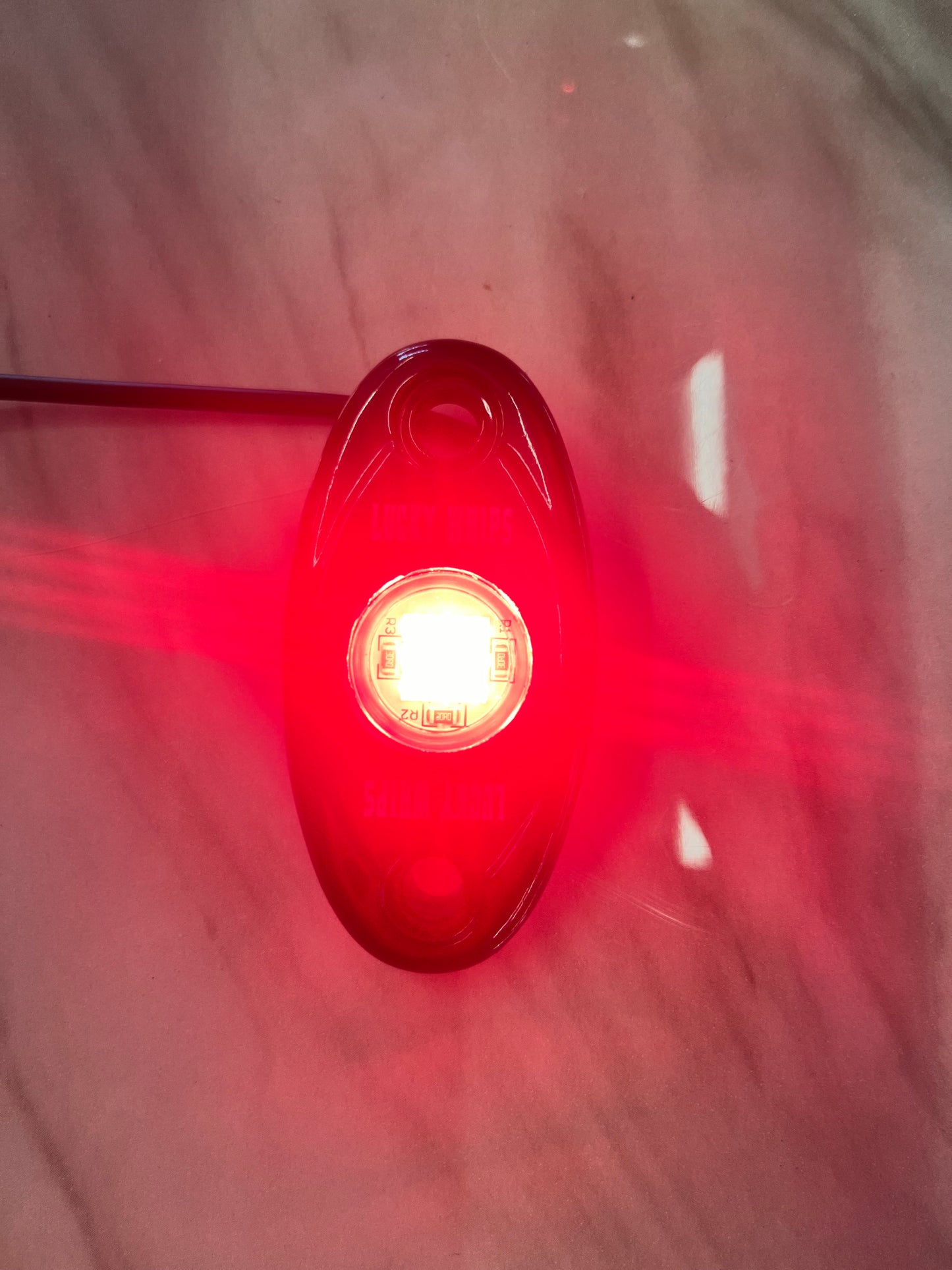 Red dome light by Lucky Whips, showcasing a sleek design and vibrant color, ideal for enhancing visibility.