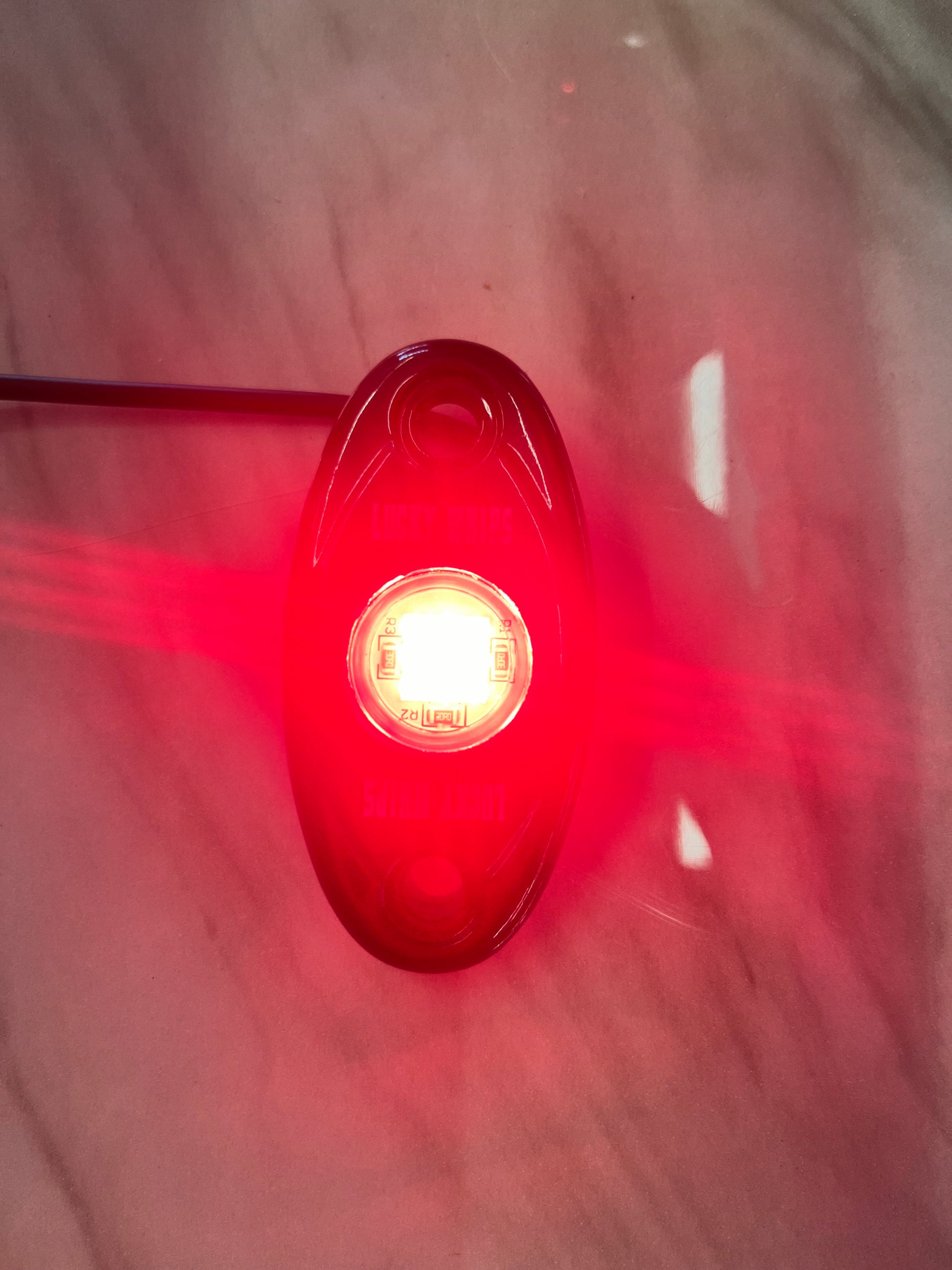 Red dome light by Lucky Whips, showcasing a sleek design and vibrant color, ideal for enhancing visibility.