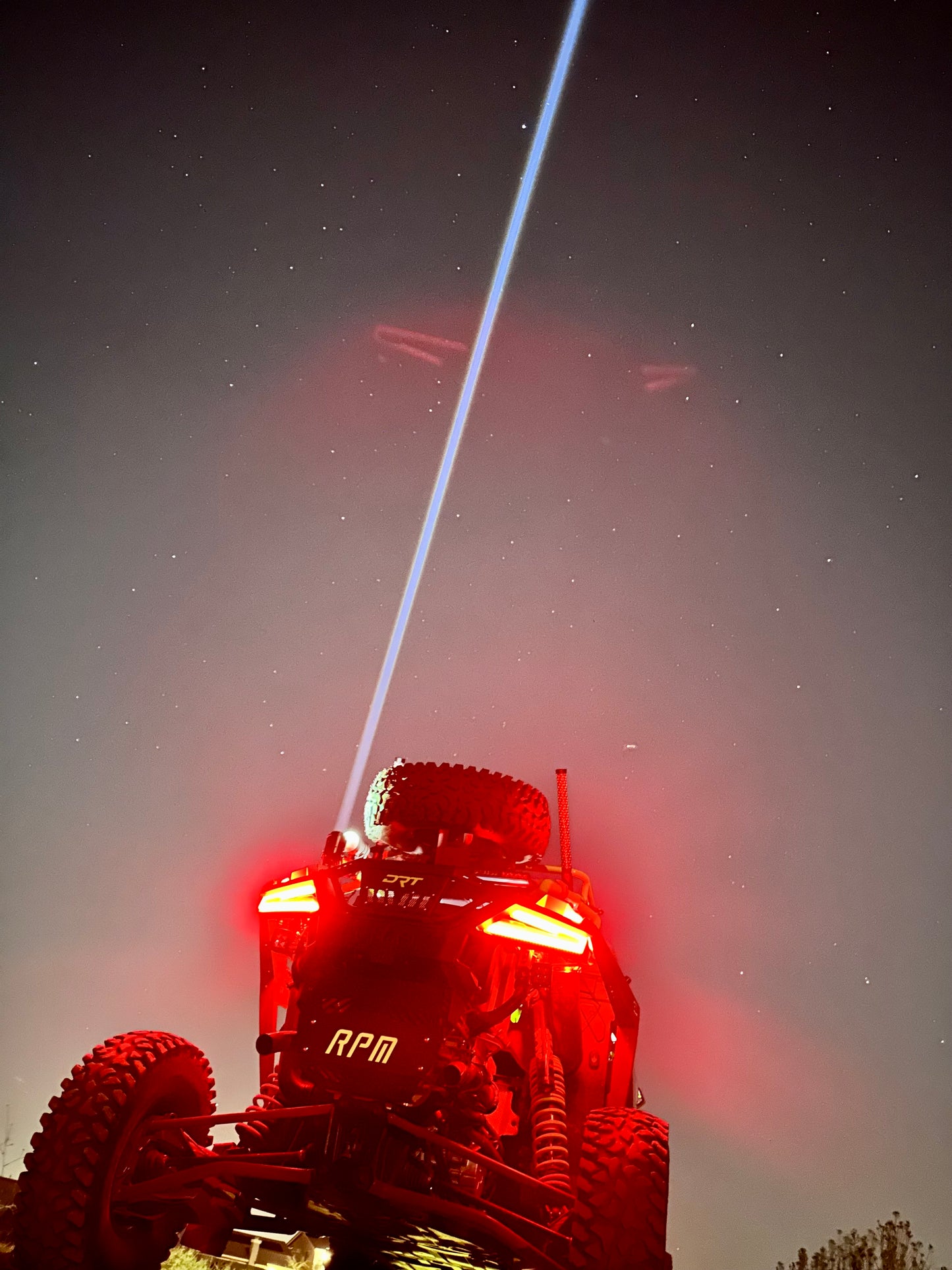 Lucky Whips Laser Pod Lights in pairs, showcasing vibrant laser patterns in a sleek, compact design.