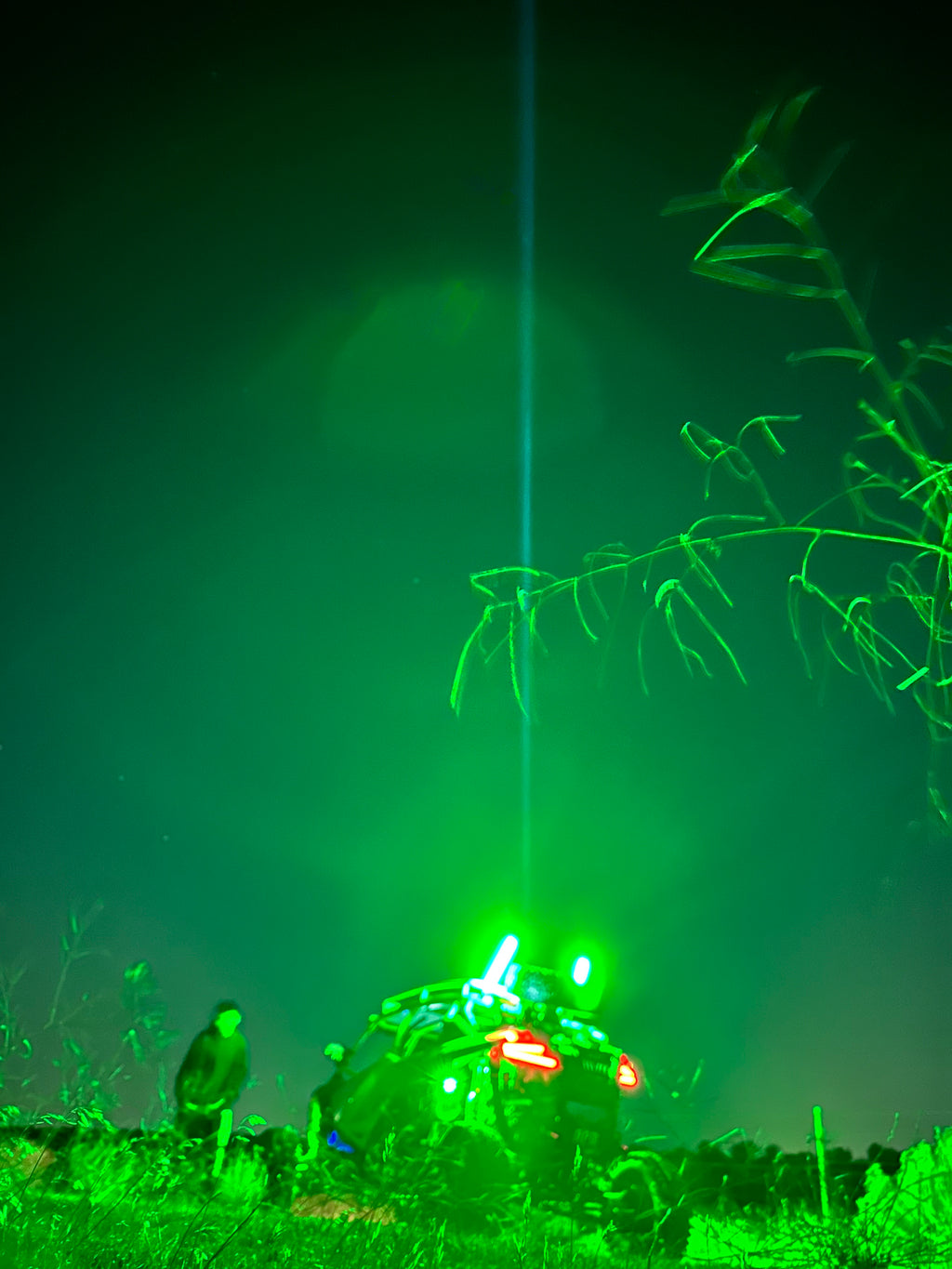 Pair of Lucky Whips Laser Pod Lights showing colorful laser patterns projected onto a surface.