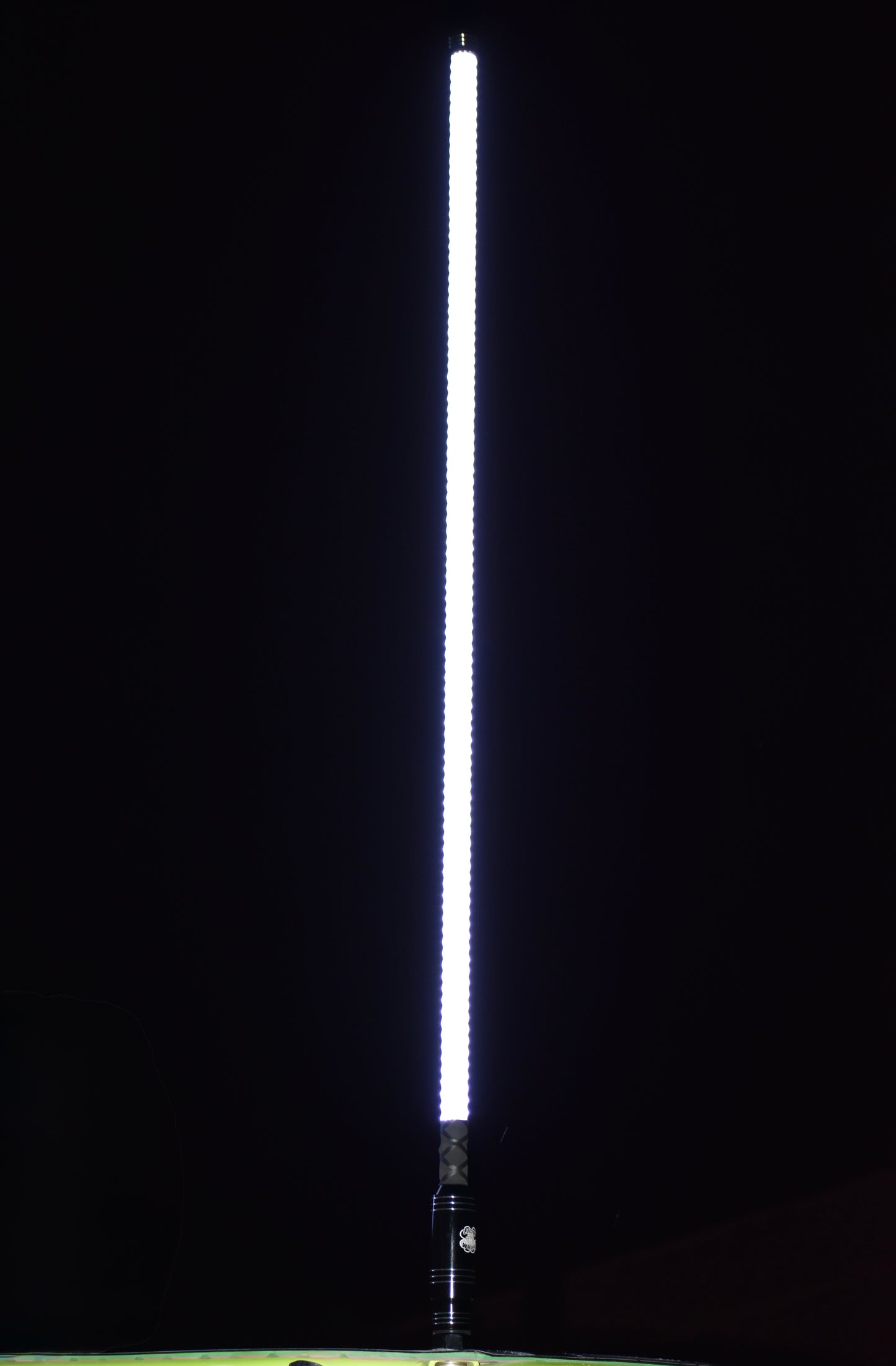 Colorful Lucky Whips LED whips glowing in the dark, showcasing vibrant lights and flexible design for off-road vehicles.