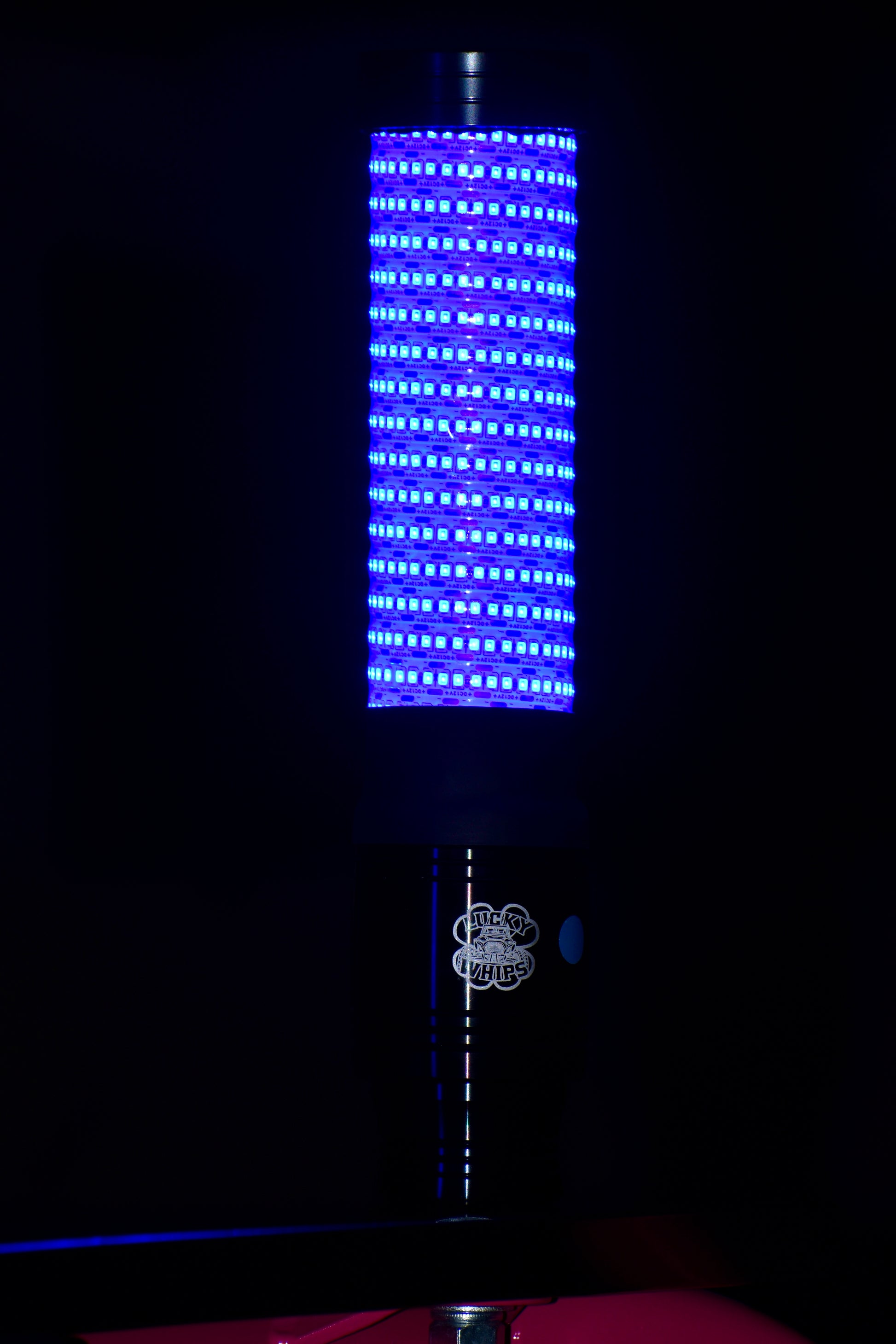 Colorful LED whips by Lucky Whips, featuring a flexible design and vibrant light display for off-road vehicles.