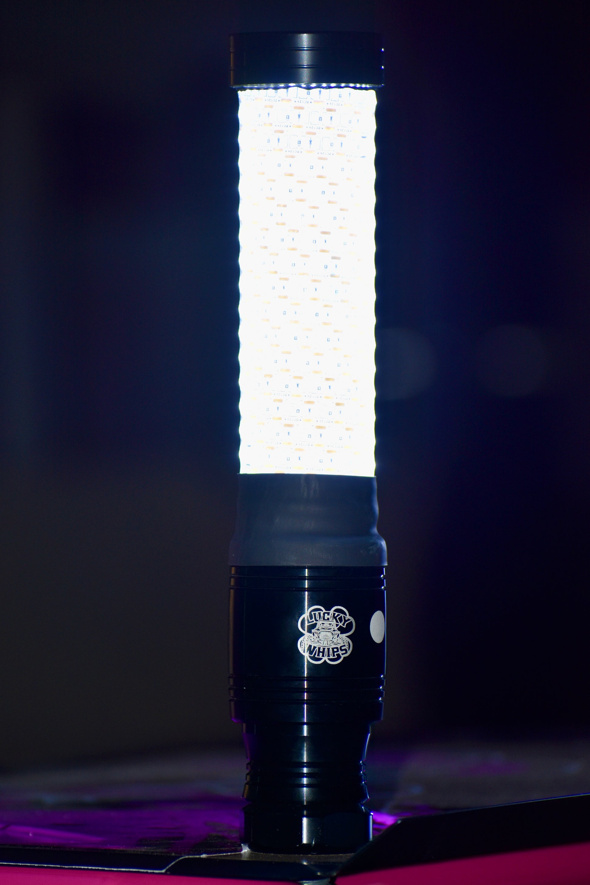 Colorful LED whips from Lucky Whips, showcasing vibrant lights and flexible design for off-road vehicles.