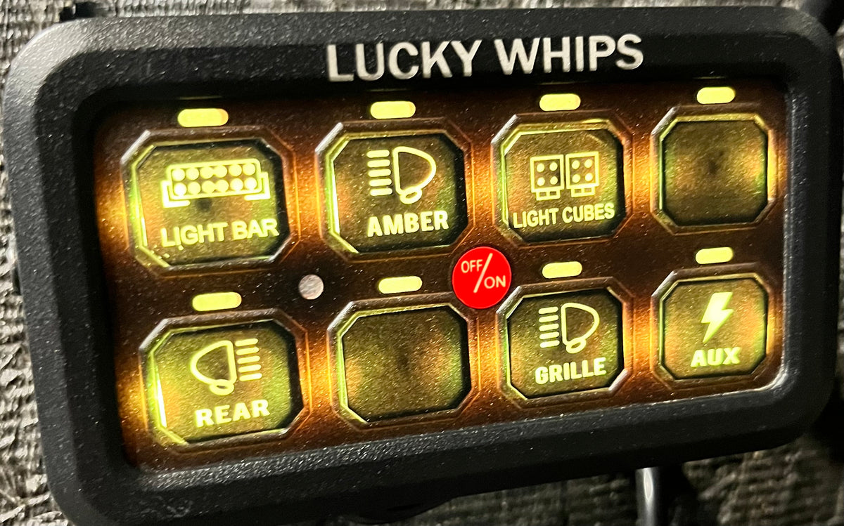 Lucky Whips 8 Gang Bluetooth Switch Panel showing multiple switch buttons on a sleek black panel.