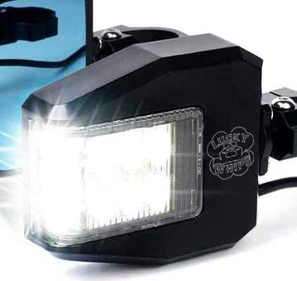 Lucky Whips UTV side view mirror showing a sleek design mounted on a rugged off-road vehicle.