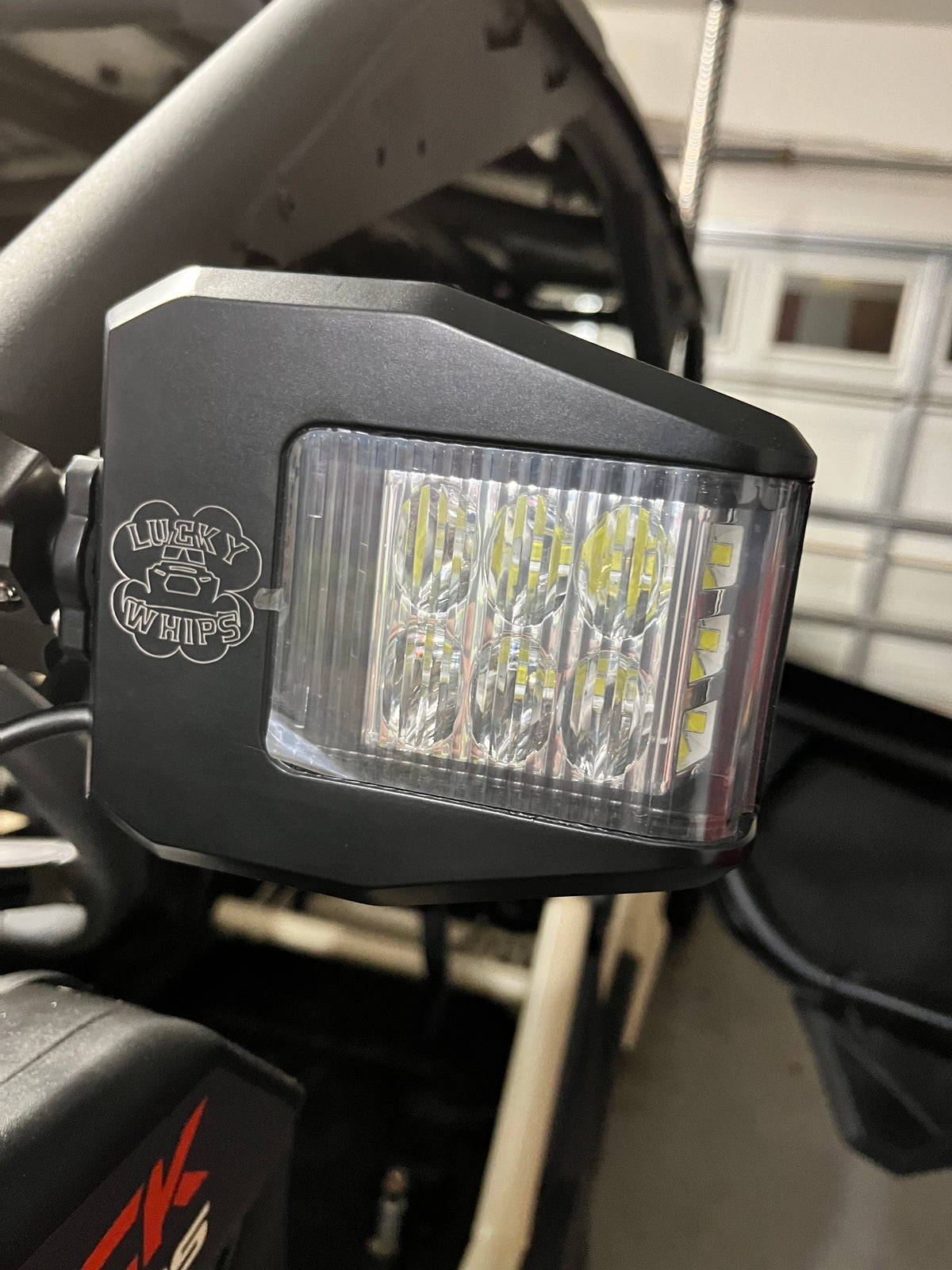 Lucky Whips UTV side view mirror showcasing a sturdy design with adjustable mounting for off-road vehicles.
