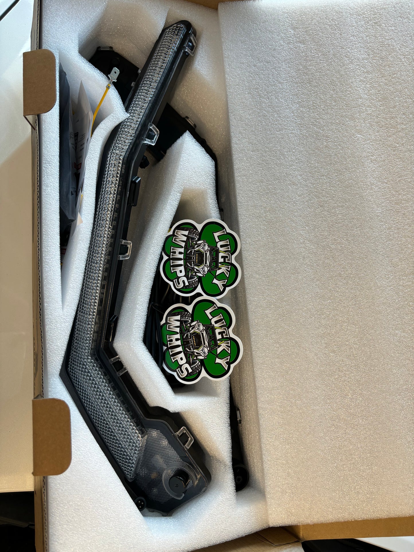 Can Am X3 RGBW Brow Lights installed on the vehicle, showcasing vibrant multicolor lighting for off-road vehicles.