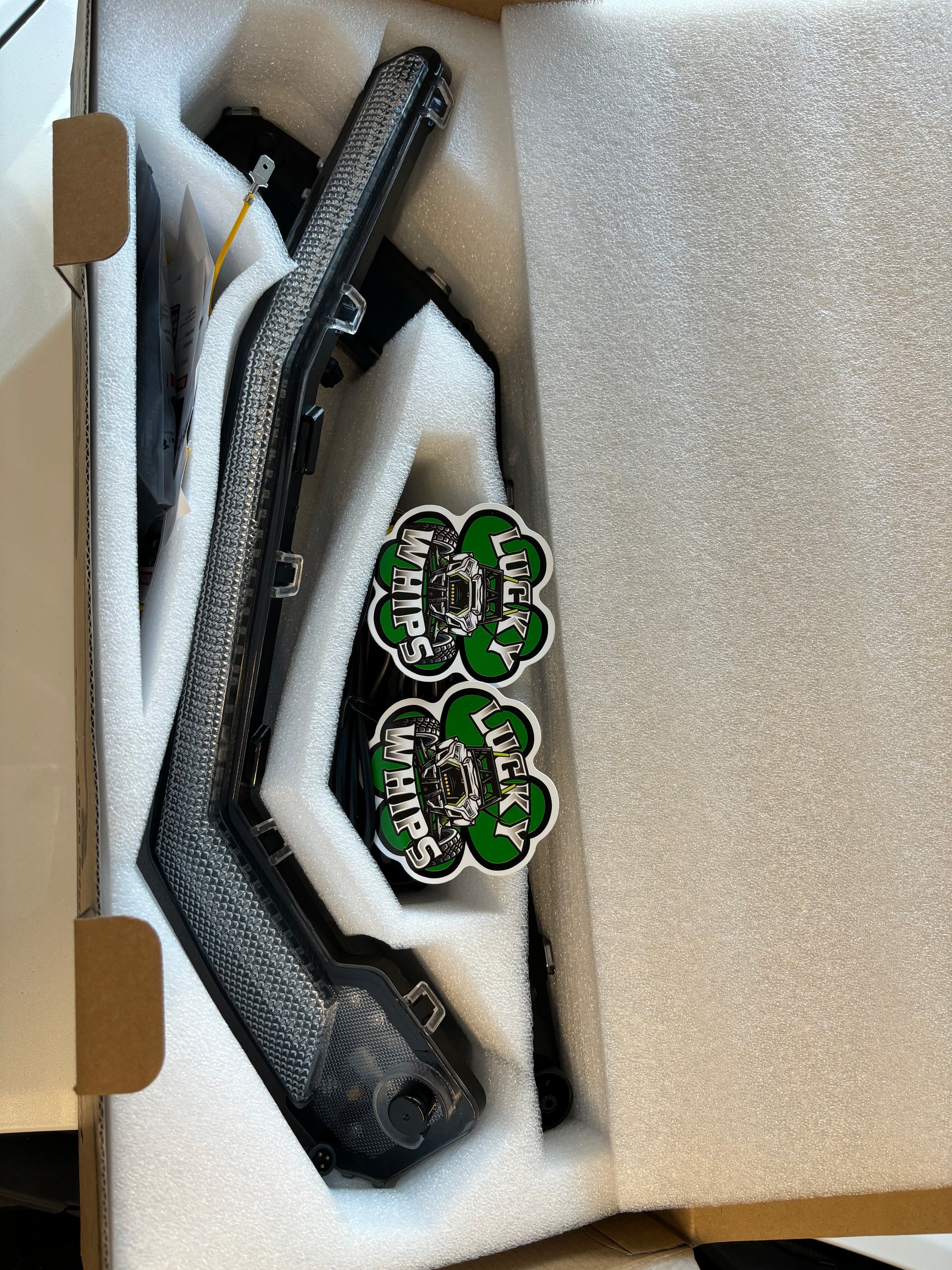 Can Am X3 RGBW Brow Lights installed on the vehicle, showcasing vibrant multicolor lighting for off-road vehicles.