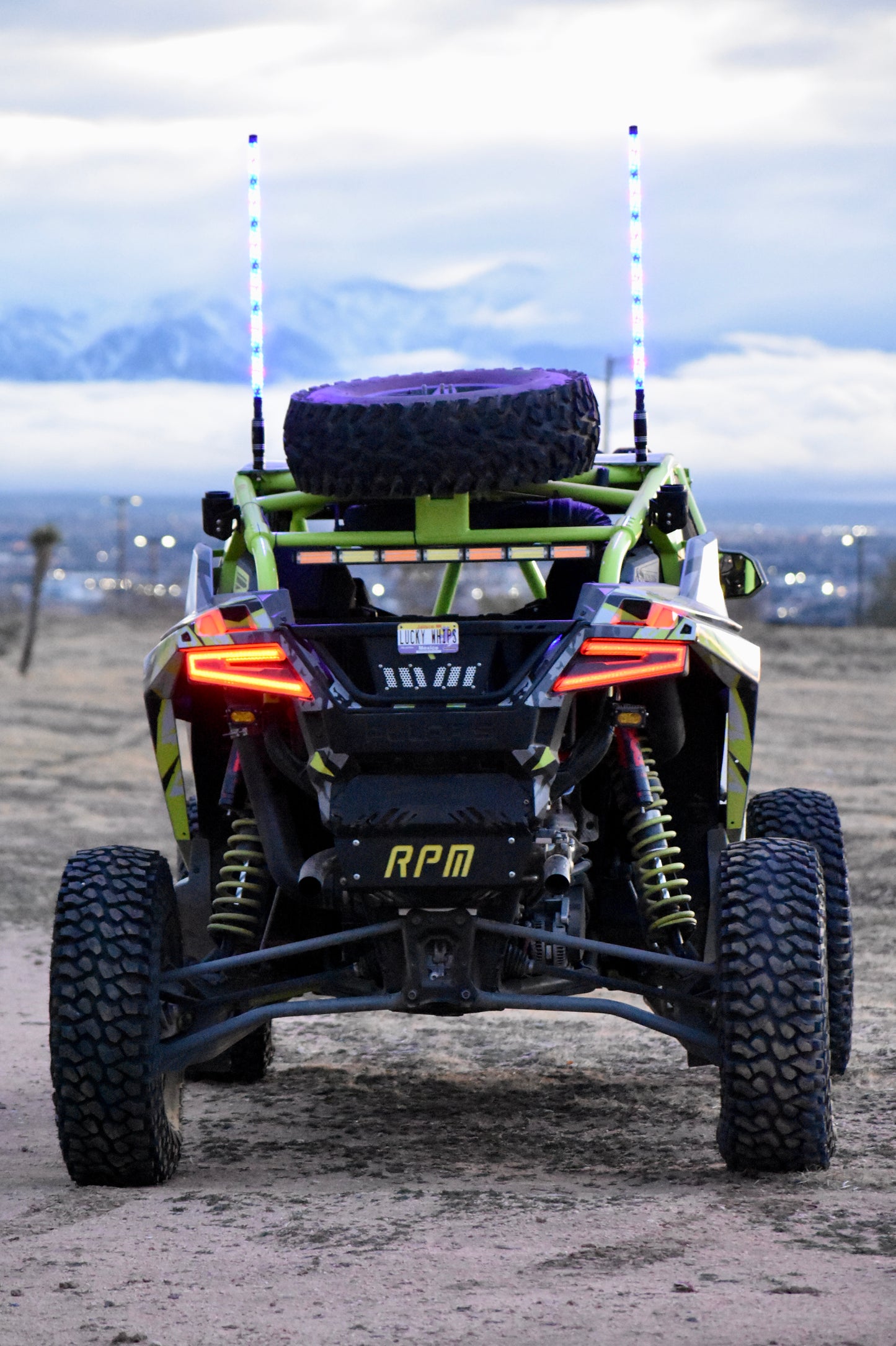 LED whips by My Store, featuring vibrant colors and flexible design for outdoor use, illuminated in a night setting.