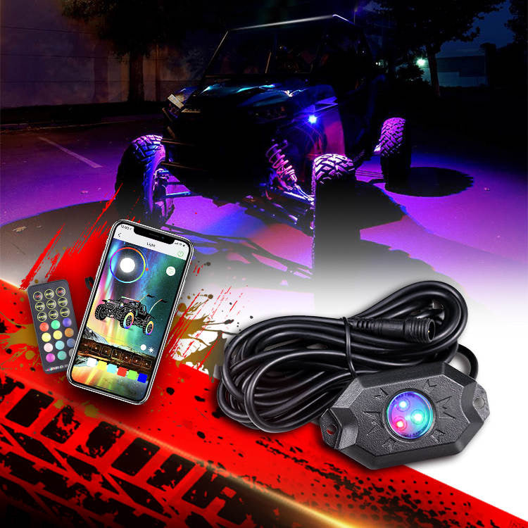 RGB LED Rock Light Kit by My Store, featuring vibrant colored lights mounted on rugged rocks in an outdoor setting.
